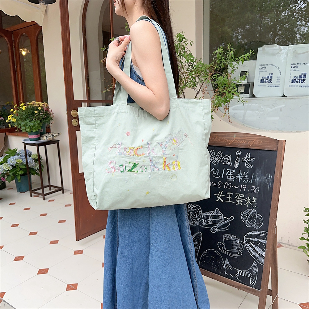 4591 Summer canvas embroidery casual and laid-back style ins Artistic hand-held single-shoulder bag shopping bag Canvas schoolbag details Picture