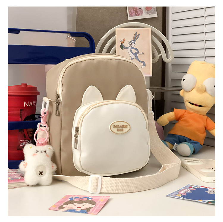 Summer cute little cat single-shoulder bag, double-sided new transparent pain bag, can hold 20cm cotton doll student backpack Application Scenario