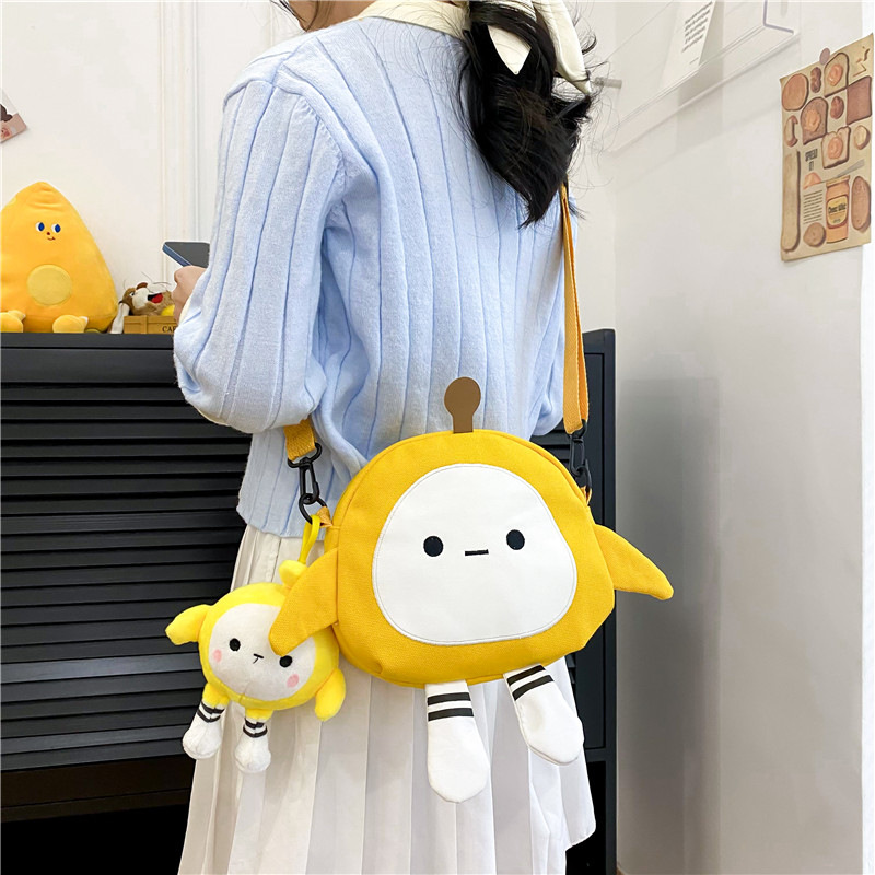 Wholesale cartoon canvas bags, cute egg boy party crossbody bags, trendy Japanese girl casual and stylish small backpacks details Picture