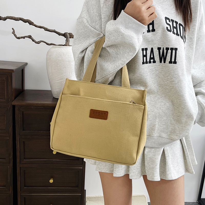 New wholesale fashionable and high-quality canvas handbag, simple and portable, easy to carry for going out, versatile lunch box and bento bag details Picture