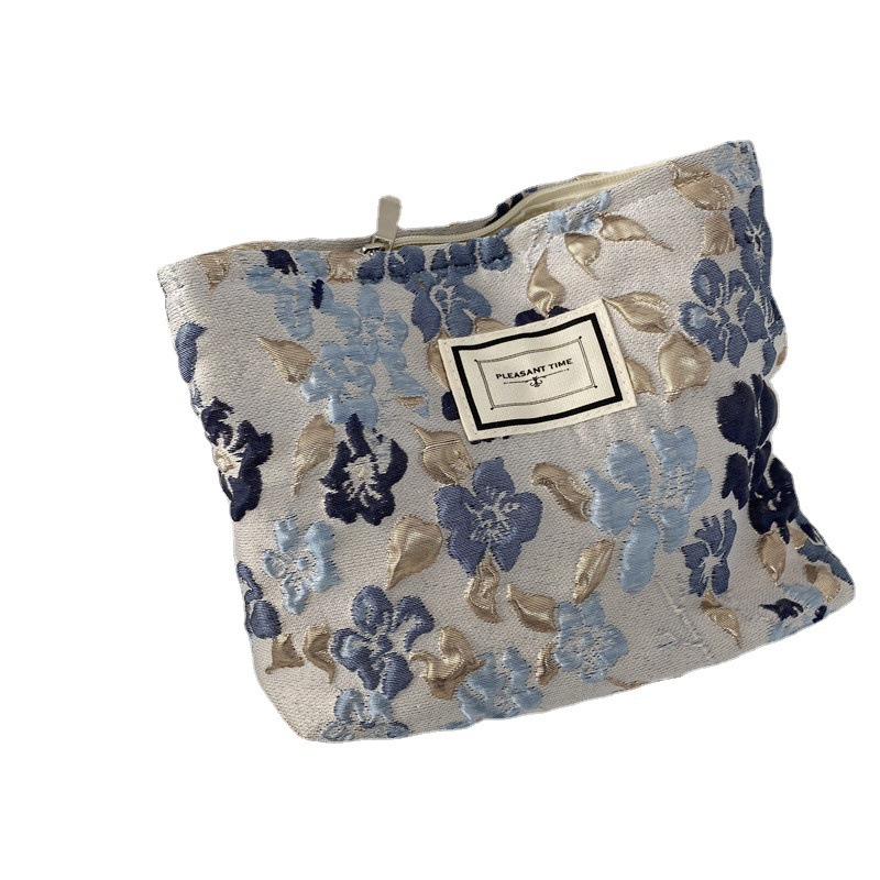 18241 French embossed flower cosmetic bag, simple large-capacity portable handbag, casual mobile phone, walking clutch Item Picture
