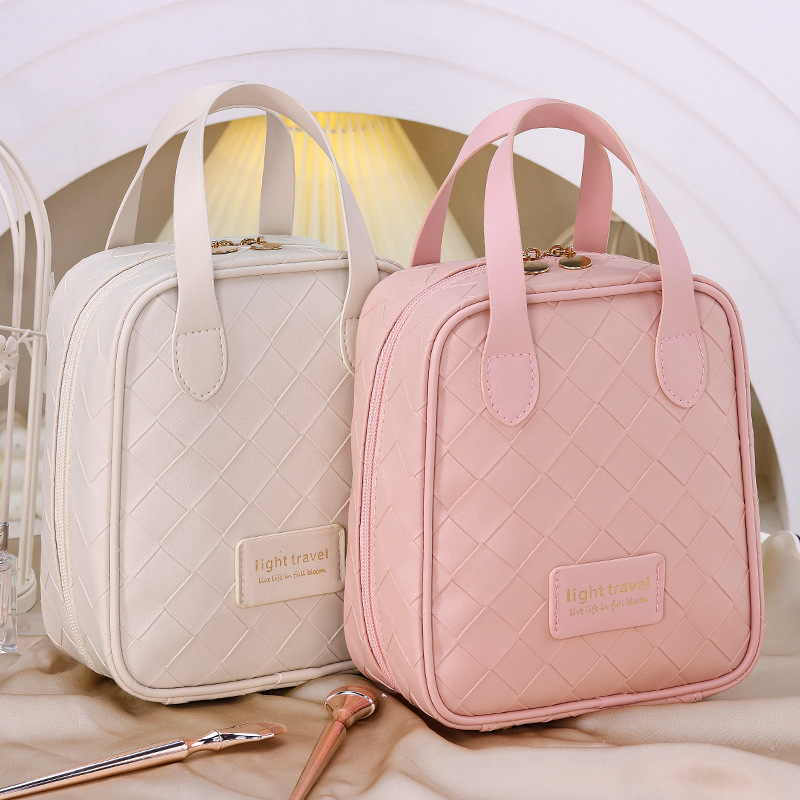 Large-capacity woven cosmetic bag, high appearance level, hand-held portable travel PU storage bag, new cosmetic storage bag full figure