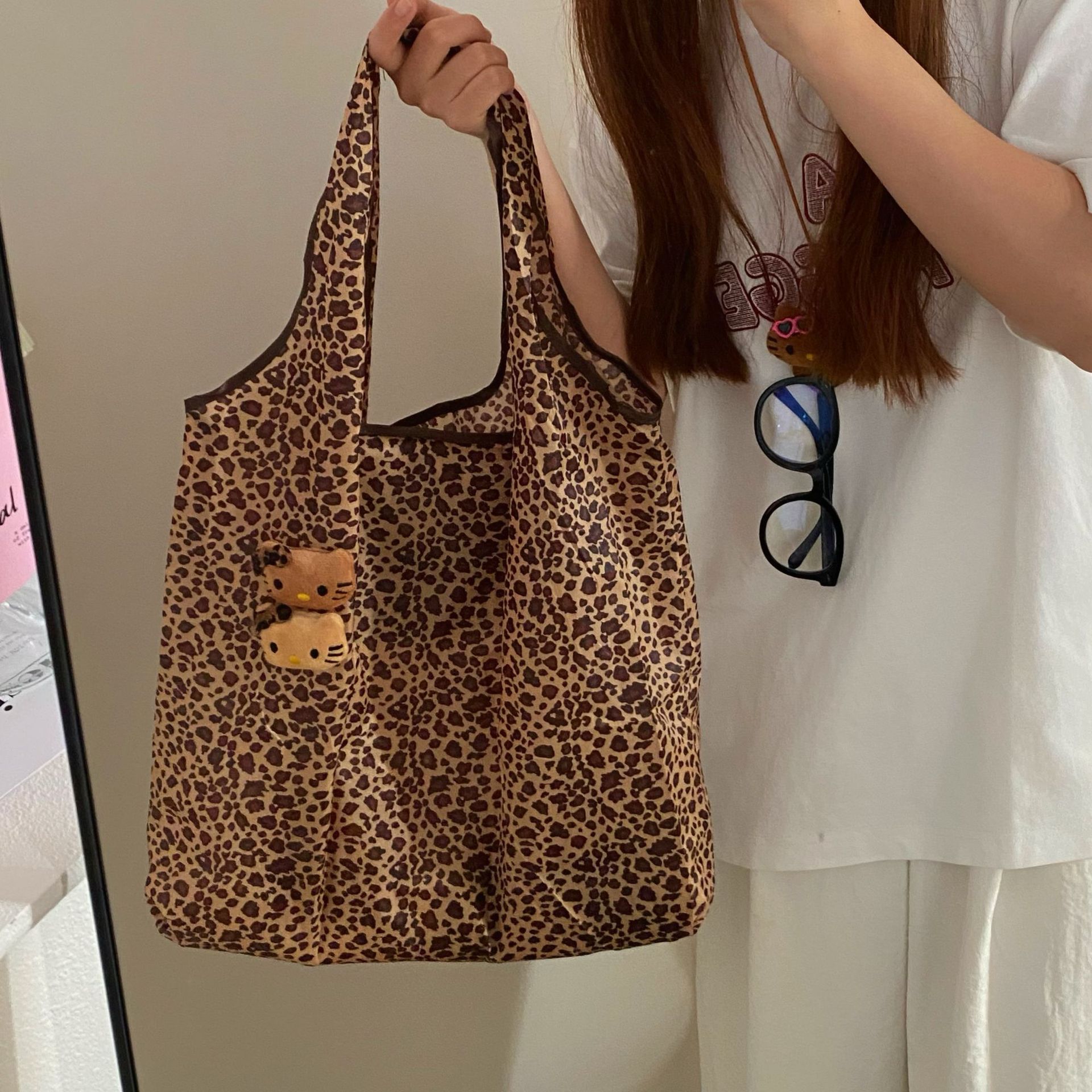 Cute leopard-print cat folding bag, large-capacity handbag, a niche portable mini eco-friendly single-shoulder bag for women full figure