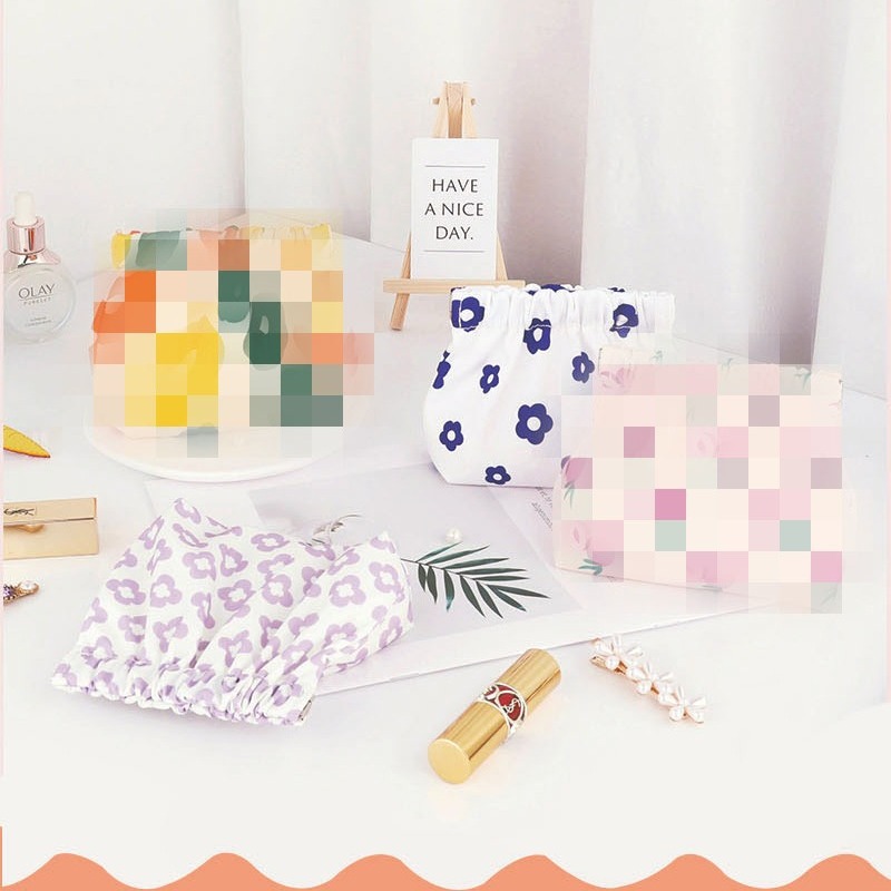 Wholesale of cosmetic bags, waterproof spring print storage bags, portable lipsticks, mini storage coin purges full figure