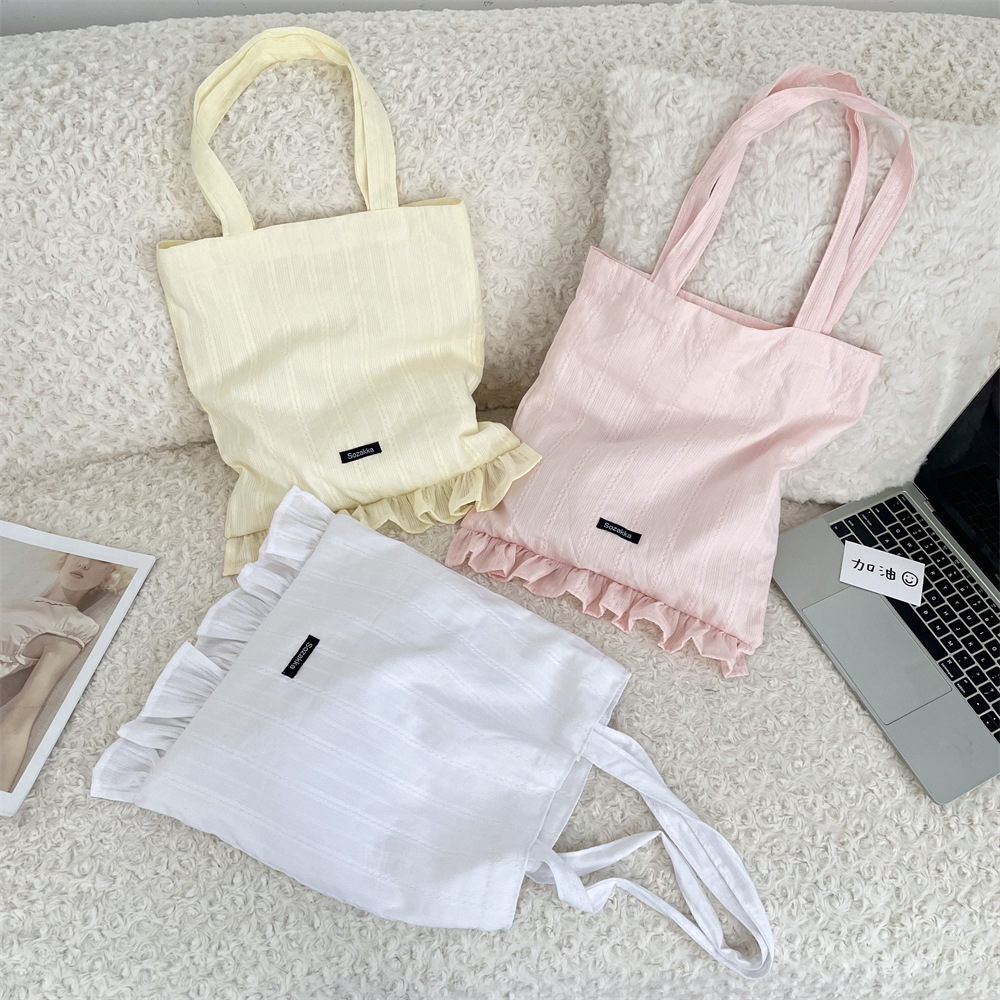 55142 2025 New InS-style simple diamond-shaped canvas bag, lace shoulder bag, large-capacity hand-held tote bag details Picture