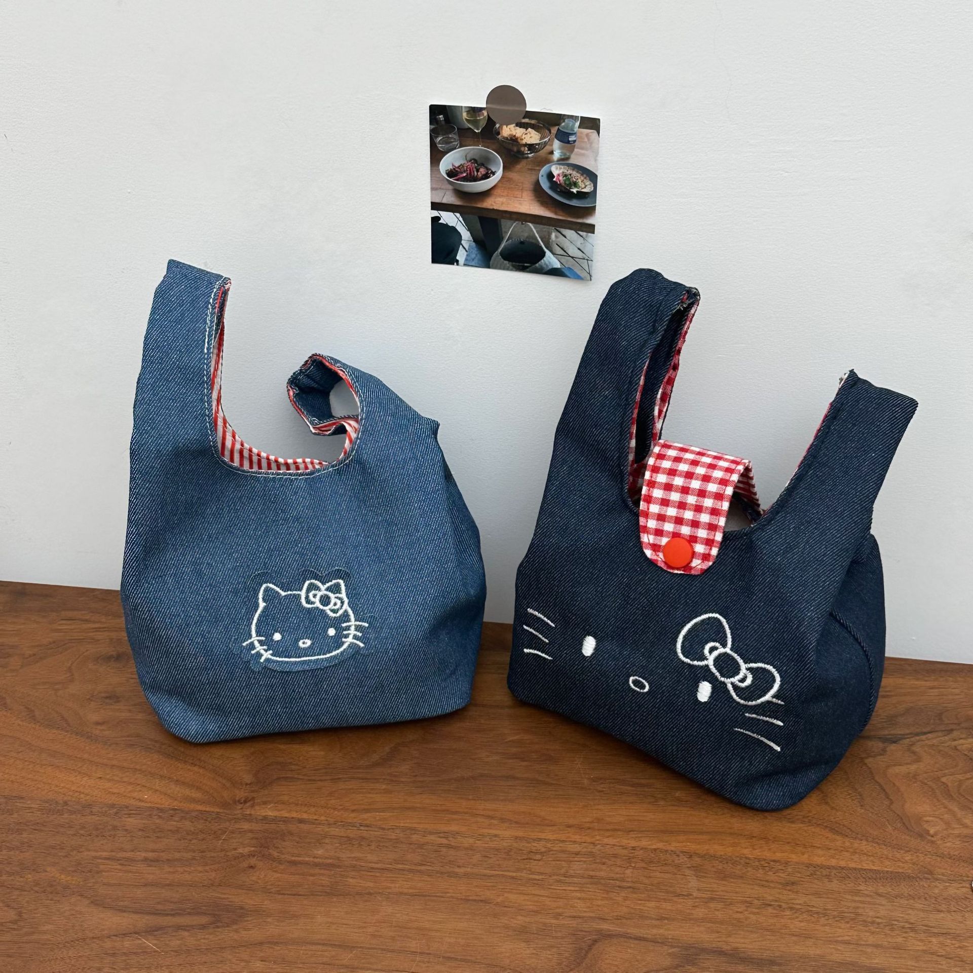 New cat-shaped denim wrist bag, cute embroidered handbag, portable large-capacity hand-held cosmetic storage bag Application Scenario