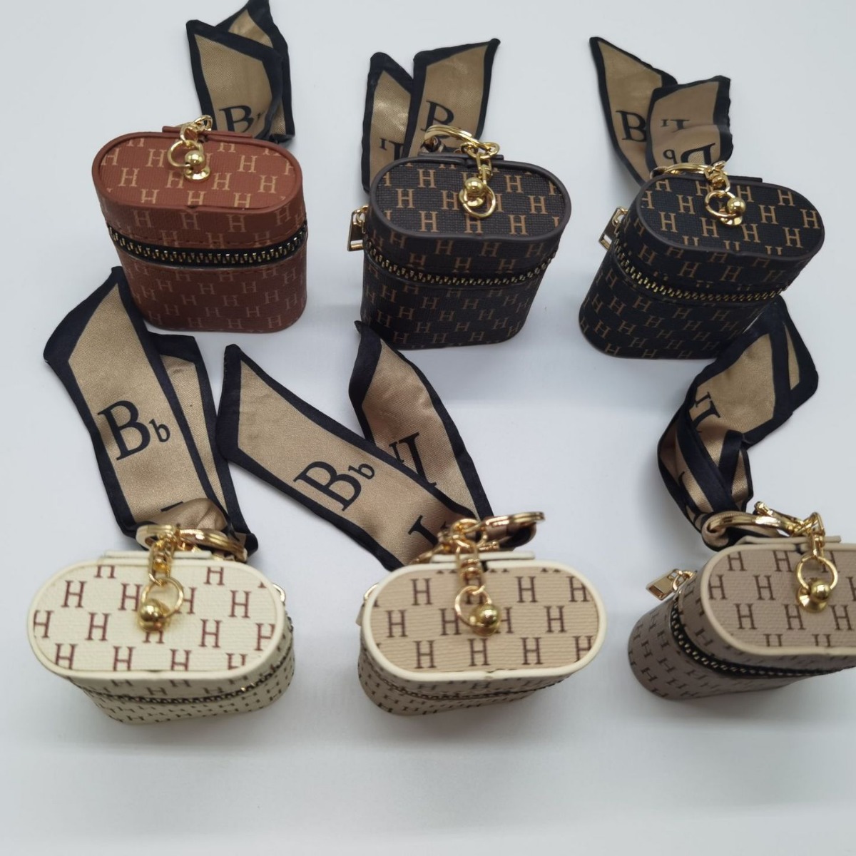 The new leather monogram coin purse keychain mini portable mouth red envelope storage wireless earphone case is cute Application Scenario