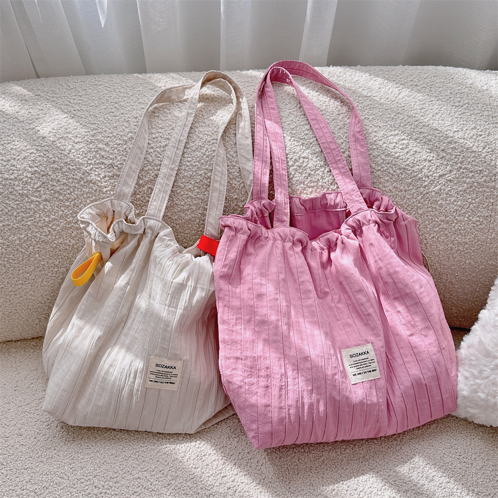 New 4941 striped drawstring single-shoulder bag, laid-back style tote fabric bag, large capacity commuter bag, student class bag full figure