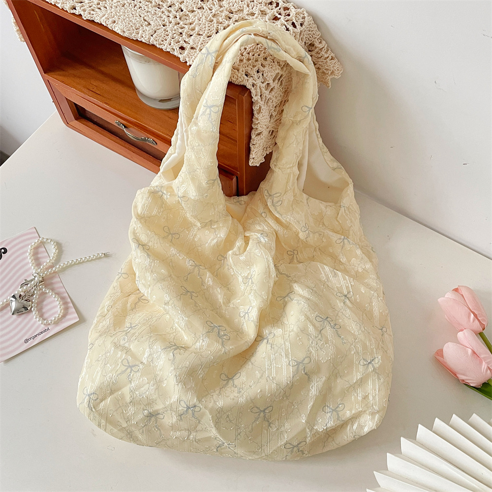 55301 Summer Fresh and delicate texture bow single-shoulder bag, fairy canvas bag, hand-held underarm vest bag details Picture