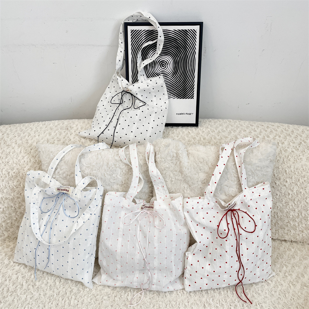 53254 Korean-style laid-back little heart canvas bag, 2025 new single-shoulder tote bag, commuter underarm bag for women details Picture