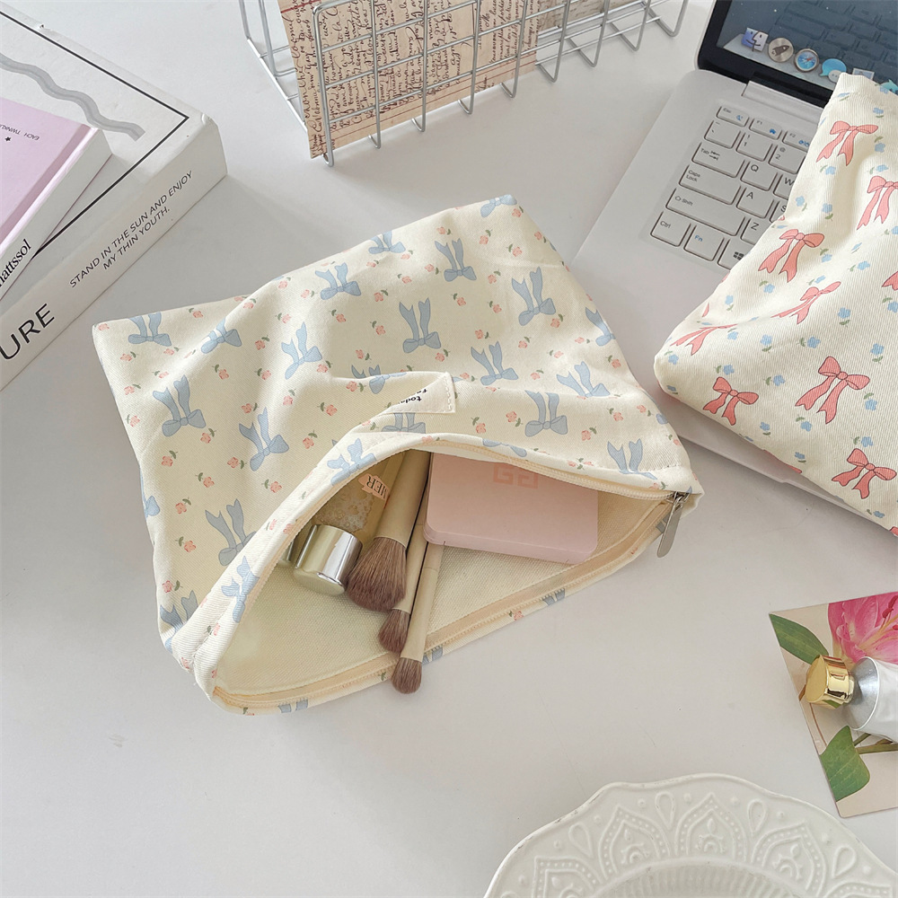 5622 Cosmetic bag with printed bow, portable skin care products storage, fabric small square bag, coin purse, and miscellaneous organization Application Scenario