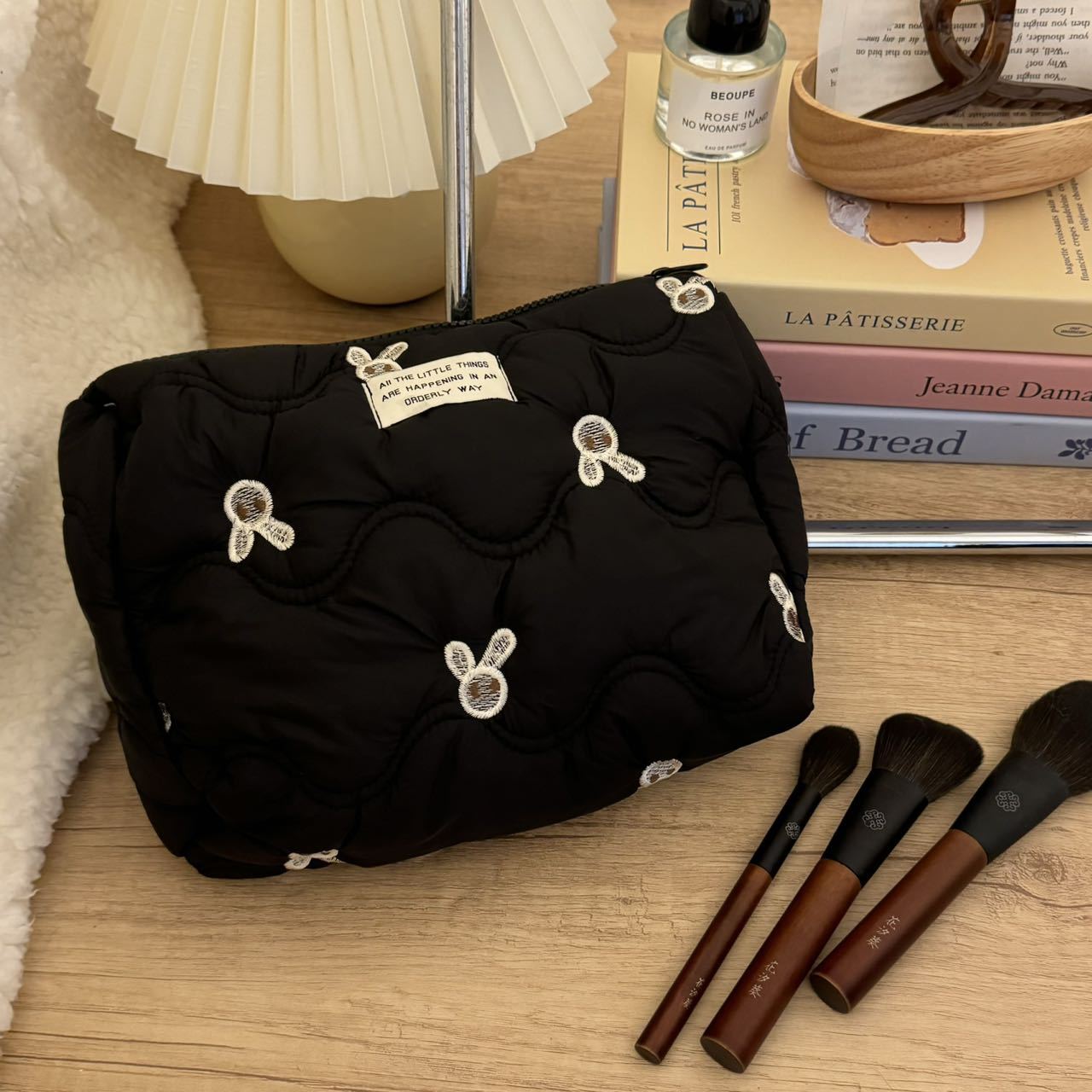 Black embroidered little rabbit makeup bag, high-end and niche storage bag, portable large-capacity travel cosmetics and toiletries bag Item Picture