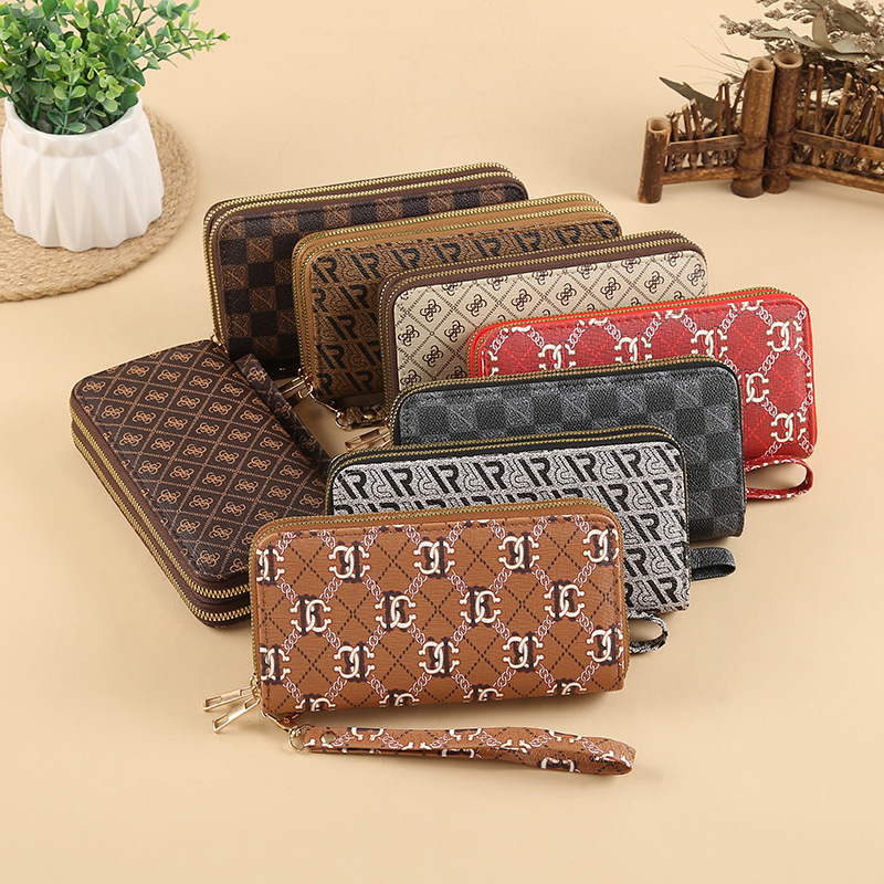 New European and American fashion wallets for women, new long wallets for ladies, large-capacity zipper clutch bags, mobile phone bags wholesale full figure