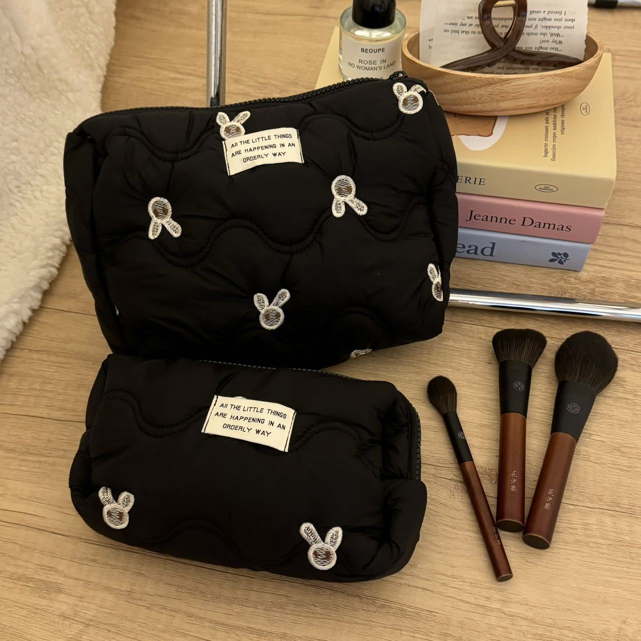 Black embroidered little rabbit makeup bag, high-end and niche storage bag, portable large-capacity travel cosmetics and toiletries bag details Picture