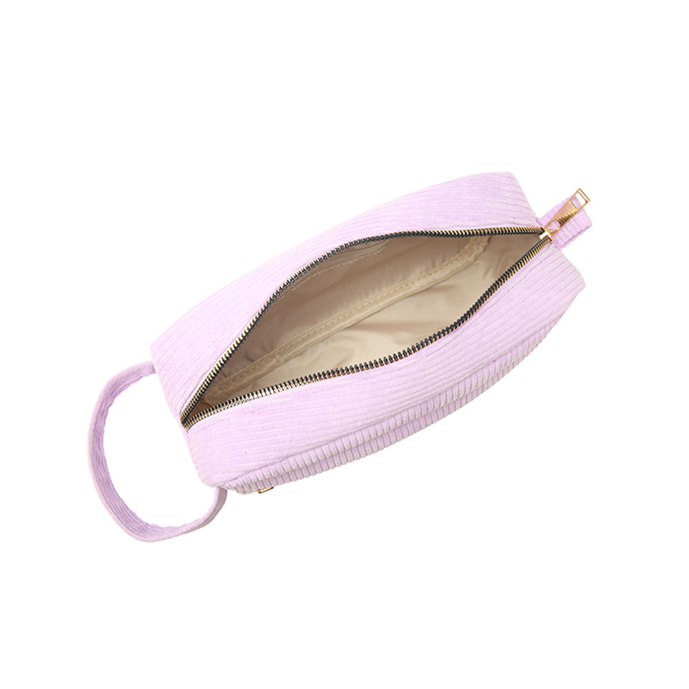 The new corduroy makeup bag is a fashionable, simple, mini and portable cosmetic lipstick storage bag with a large hand-held capacity Application Scenario