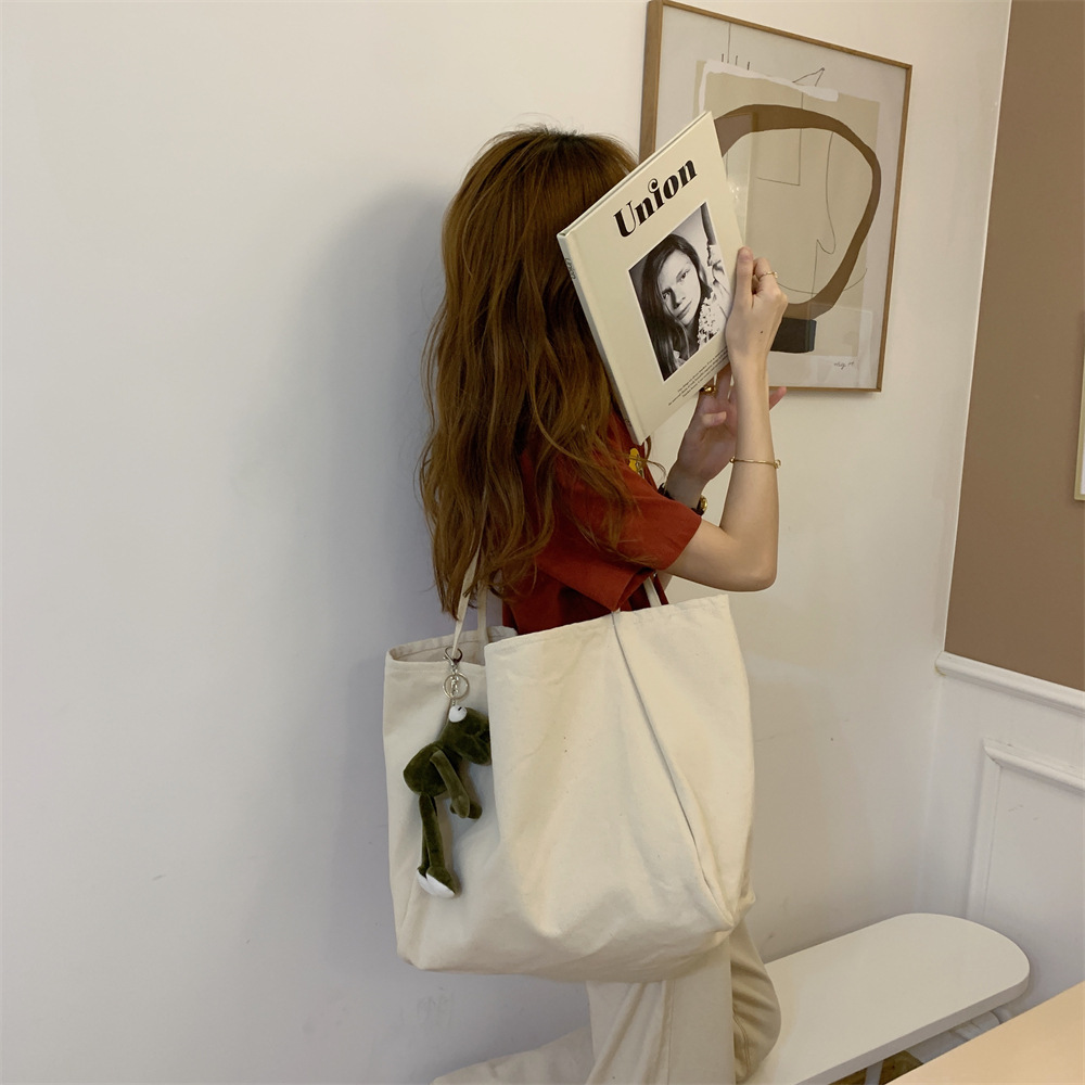 K44 dual-purpose solid color large-capacity tote bag, retro canvas bag, outdoor handbag, student single-shoulder schoolbag details Picture
