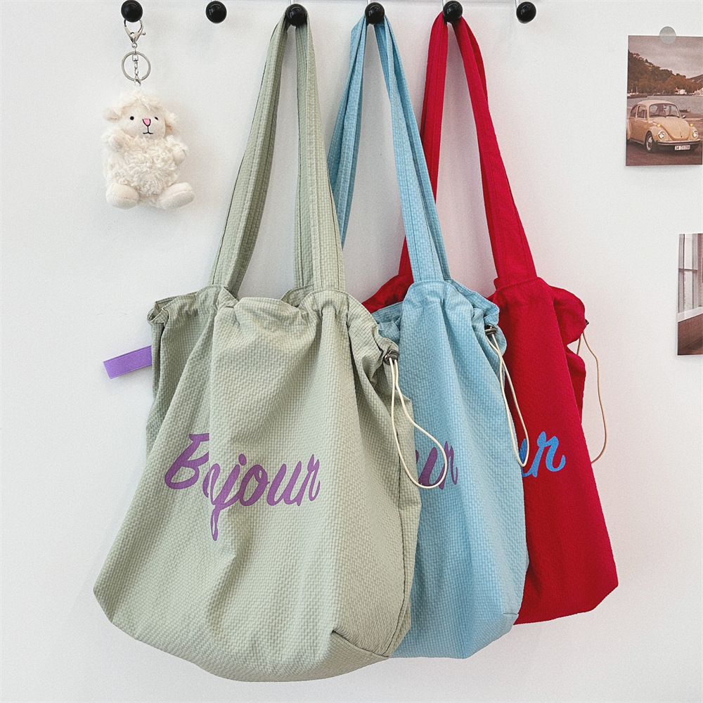 4892 Summer Travel lightweight nylon large-capacity bag for women, new lettered drawstring canvas bag details Picture