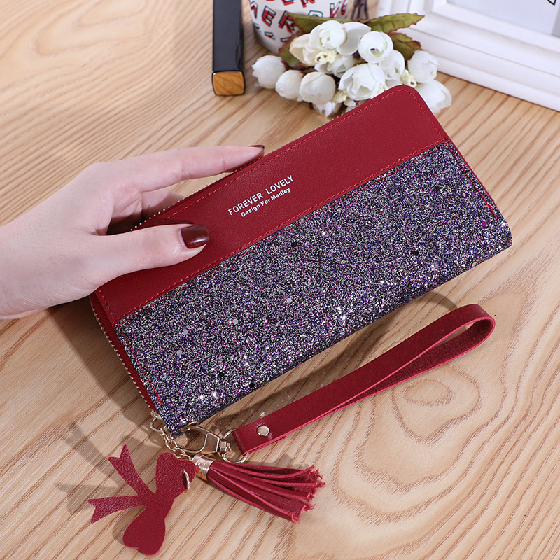 2020 new wallet long women's zipper money clip female Korean version splicing collision color tassel everything card bag mobile phone bag Application Scenario