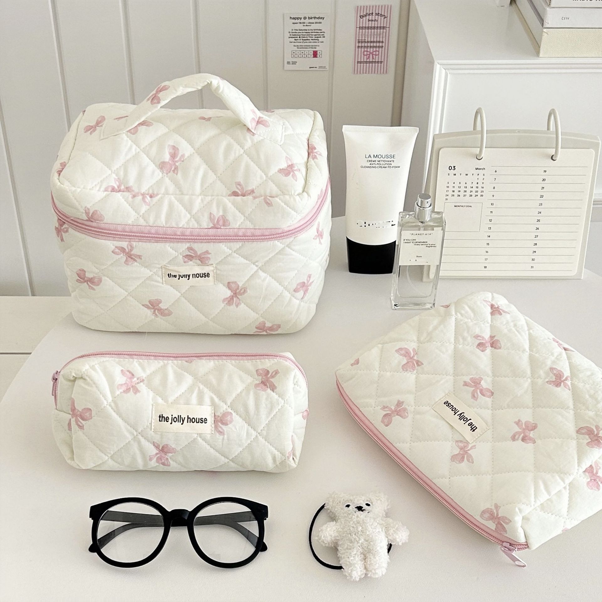 Korean-style simple bow makeup bag, large-capacity portable, business trip and travel toiletry bag, cosmetics storage bag for girls full figure