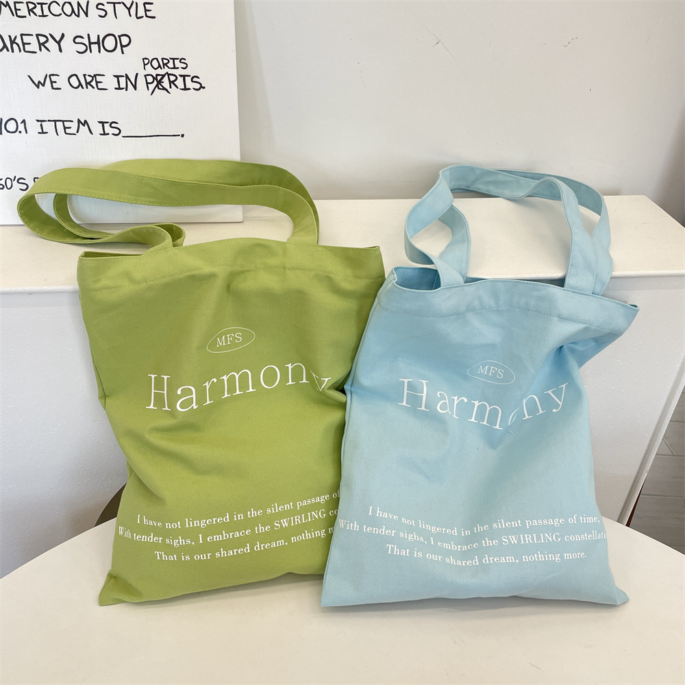 53223 Korean Instagram niche canvas bag, large capacity solid color letter printed shopping cloth bag, hand-held women's bag Application Scenario