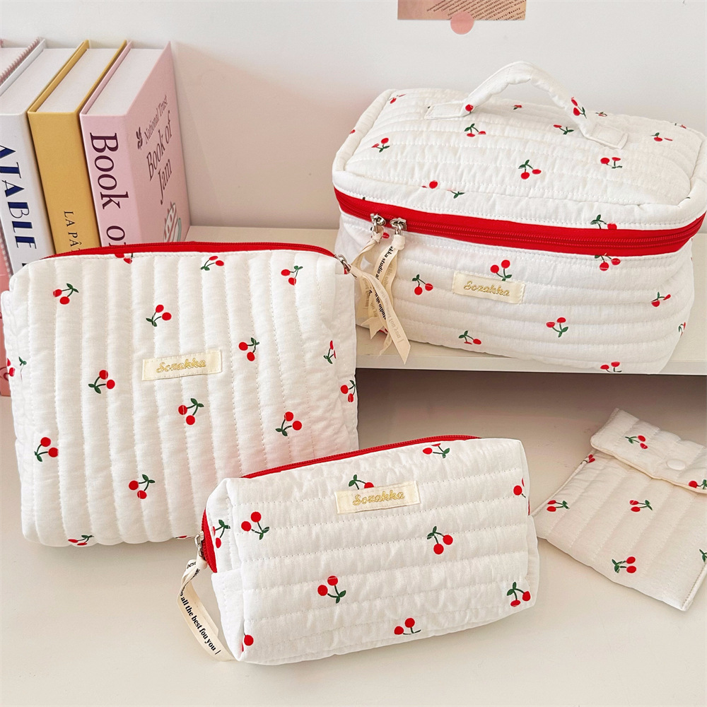 46182 Cute cherry print fabric toiletries bag, large-capacity portable travel storage bag, women's hand-held makeup bag Application Scenario