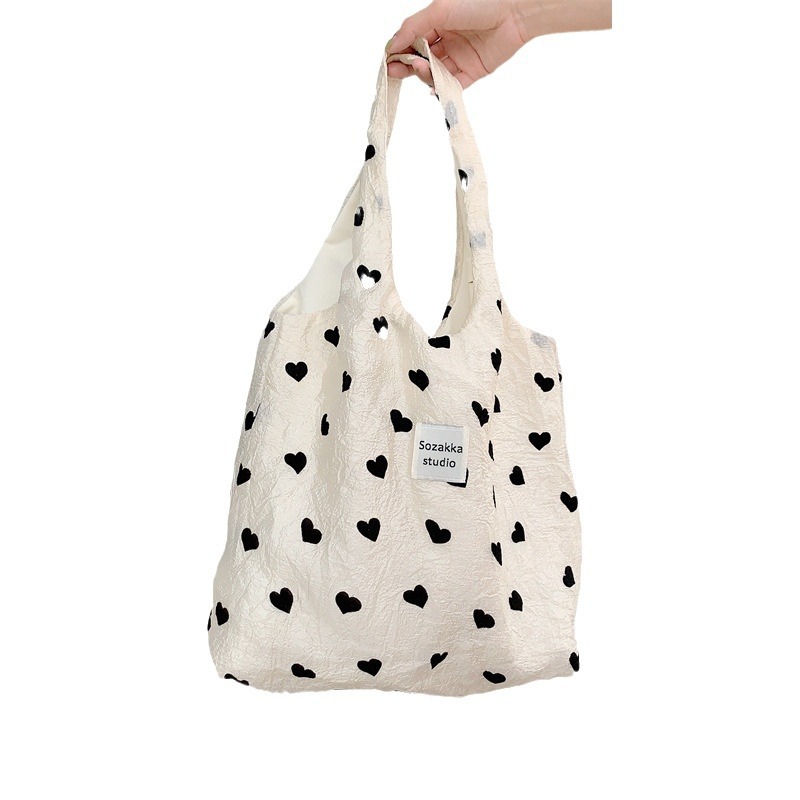 36252 New textured heart-shaped canvas single-shoulder backpack, large-capacity handbag, makeup bag, student underarm bag Item Picture