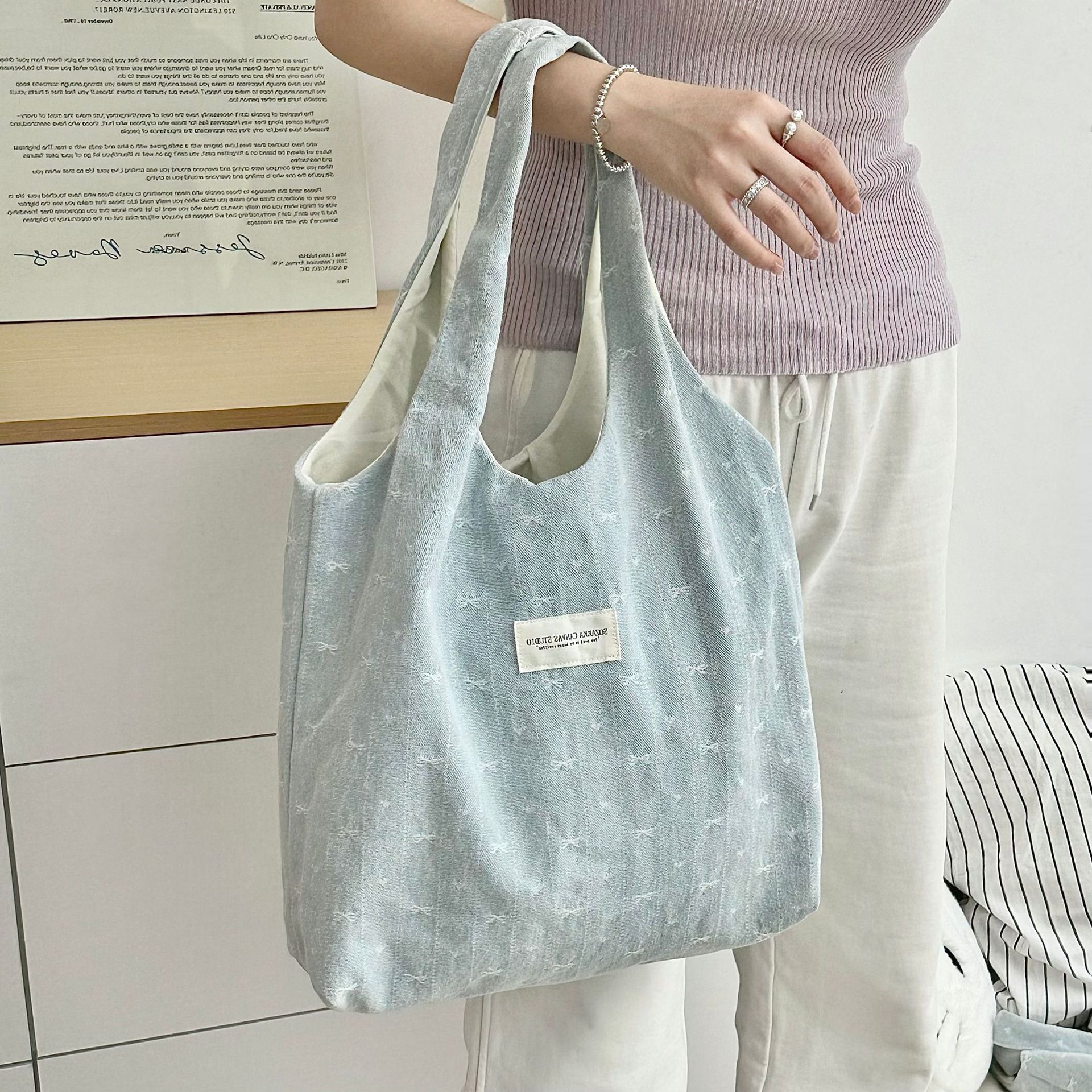 A fresh and simple denim bow vest bag for women, light blue bow embroidery, unique and versatile, large-capacity single-shoulder bag details Picture