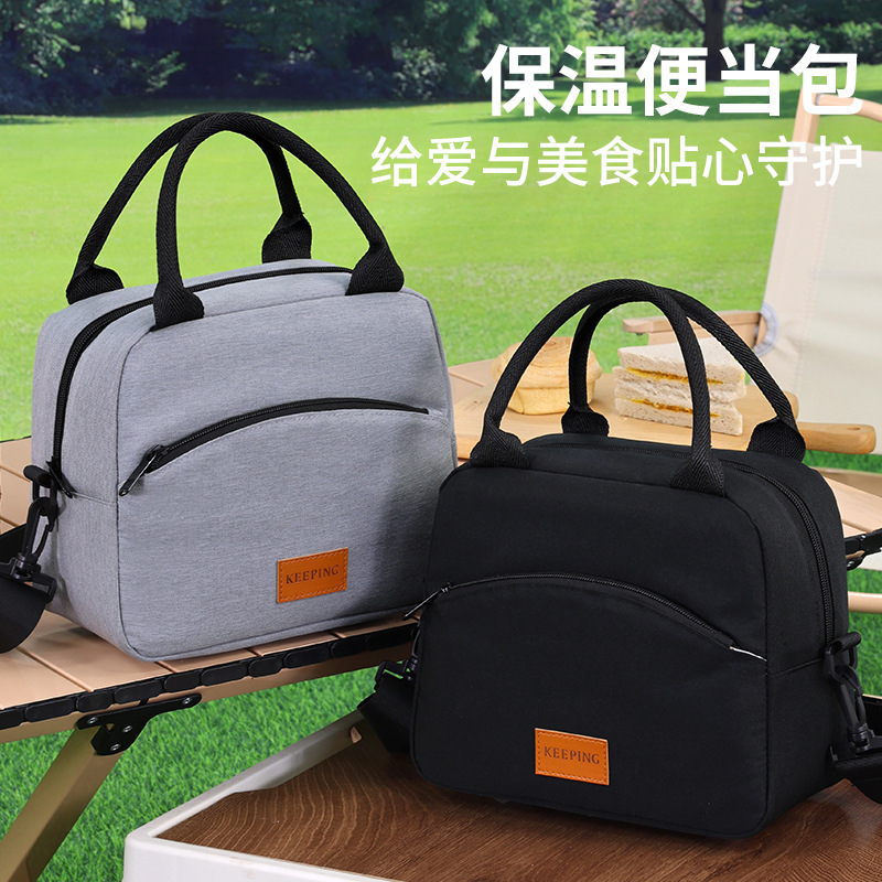 The new cross-border hand-held lunch box bag can be carried diagonally. It is waterproof, oil-proof and heat-insulating. It is a large-capacity lunch box bag for office workers with rice full figure
