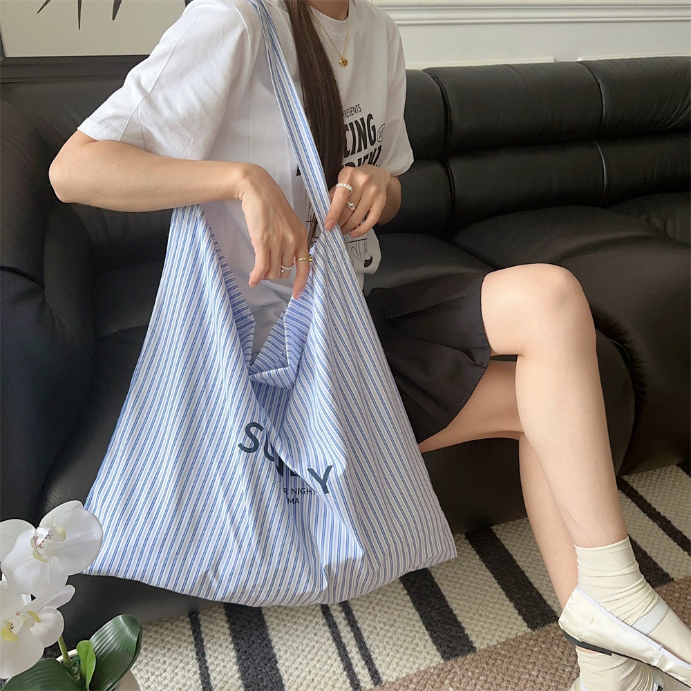 47271 Summer Letter blue and white striped canvas bag, casual and laid-back style, large-capacity single-shoulder crossbody underarm bag Application Scenario