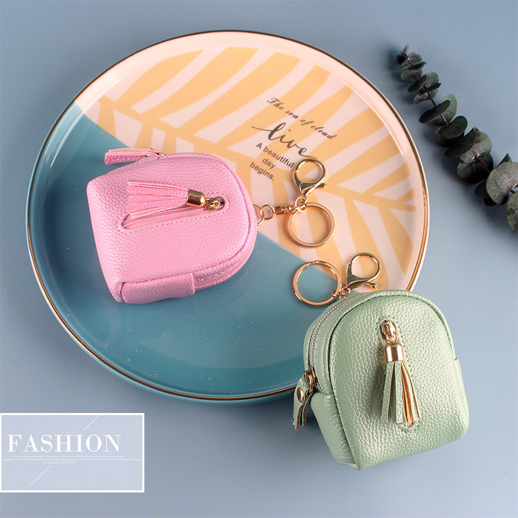 A mini Instagram girl is holding a cute, multi-functional, double-zipper, multi-layer card wallet in one full figure