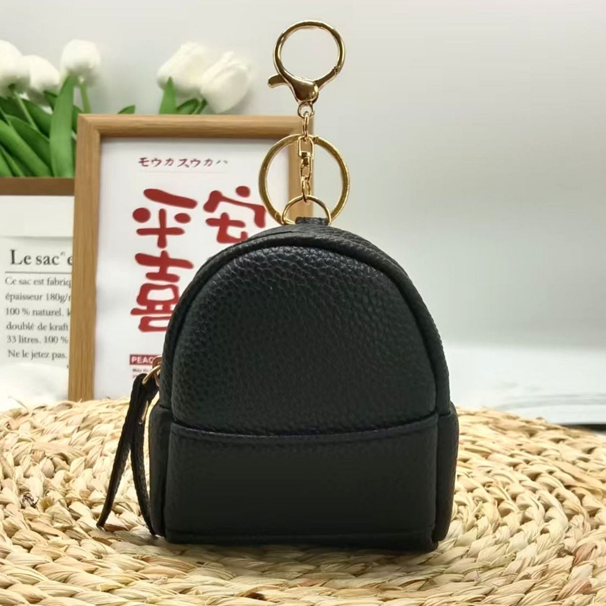 2024 New lychee-patterned small backpack keychain mini portable storage wireless headphones, loose change Application Scenario