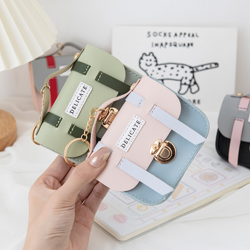 Wholesale of cute female creative mini and small wallets, lid-style lock coin cases, keychains, pendants, and small wallets details Picture