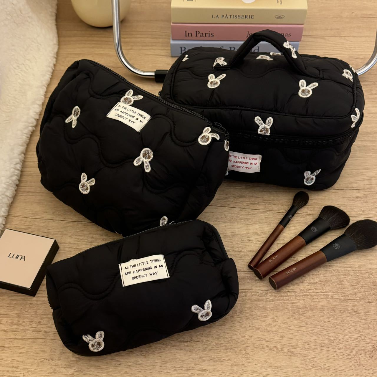 Black embroidered little rabbit makeup bag, high-end and niche storage bag, portable large-capacity travel cosmetics and toiletries bag full figure
