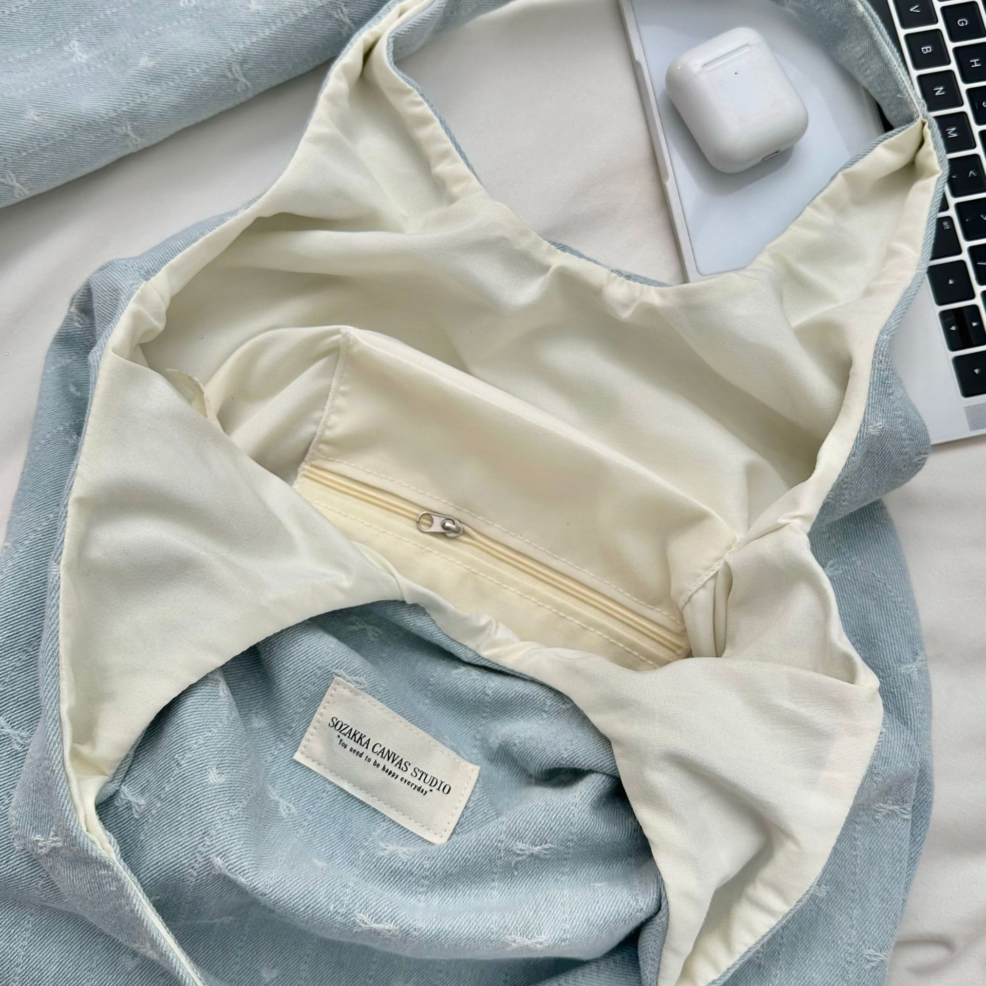 A fresh and simple denim bow vest bag for women, light blue bow embroidery, unique and versatile, large-capacity single-shoulder bag Application Scenario