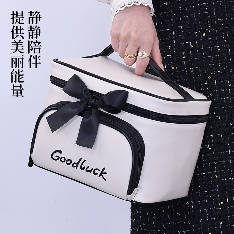 Light luxury small fragrance style, large-capacity cosmetics storage bag with compartmentalized layers, travel portable multi-functional hand-held makeup case details Picture