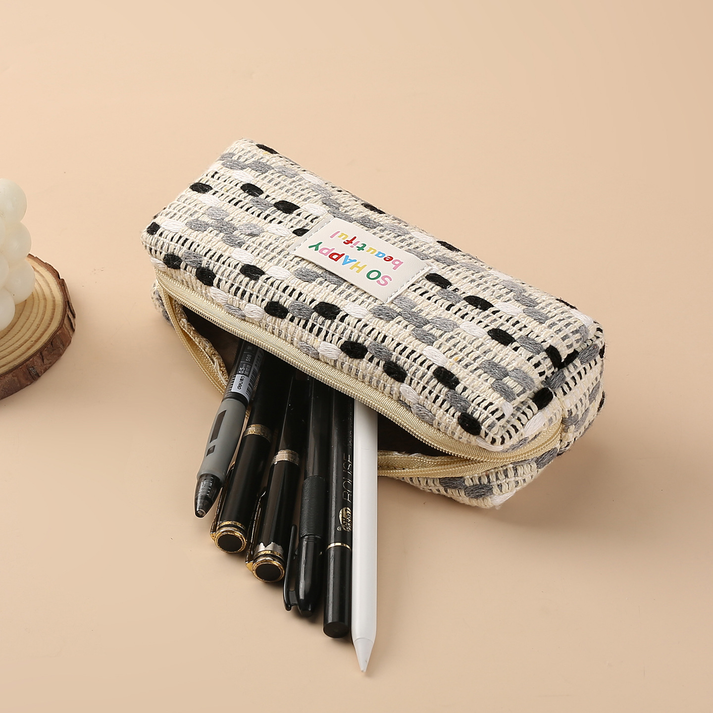 Rainbow woven pen case, a small chanel-style woven woolen design with a contrasting color, large capacity and high appearance level pen case storage bag Application Scenario