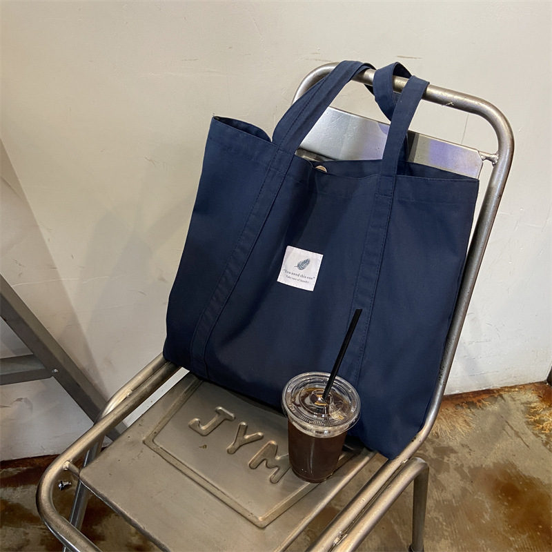 910242 Coffee solid color, fresh and simple ins, artistic and retro forest-themed women's single-shoulder canvas bag tote bag Item Picture