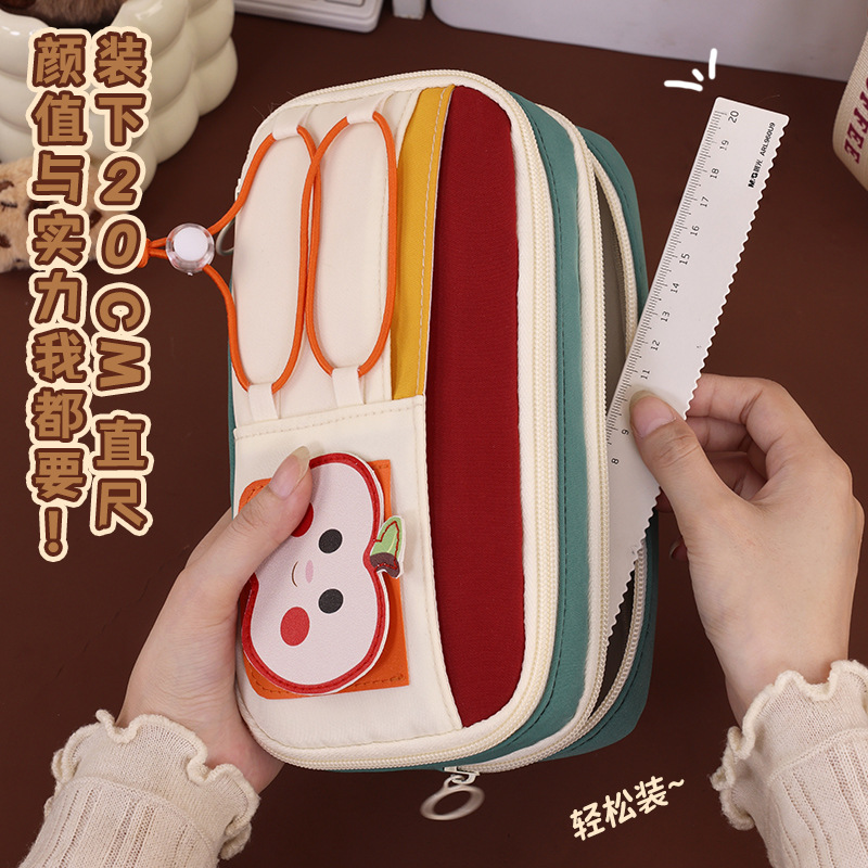 Back-to-school season pencil case, large capacity, cute and fun Apple pencil case, multi-layer stationery bag for primary school students, drawstring, high appearance level Application Scenario
