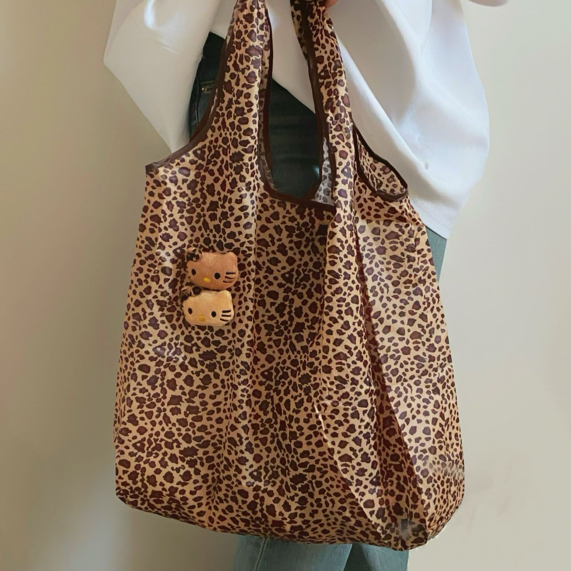 Cute leopard-print cat folding bag, large-capacity handbag, a niche portable mini eco-friendly single-shoulder bag for women details Picture