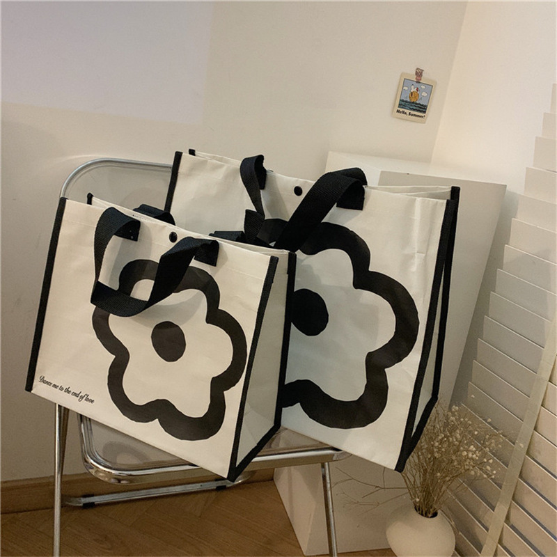 Korean minimalist ins black and white flower large-capacity hand-held shopping bag, single-shoulder large-sized eco-friendly shopping bag full figure