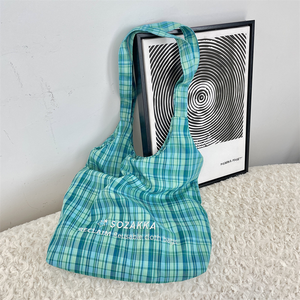 53162 New large-capacity, simple embroidered single-shoulder checkered bag, lightweight commuting canvas bag, vest bag Application Scenario