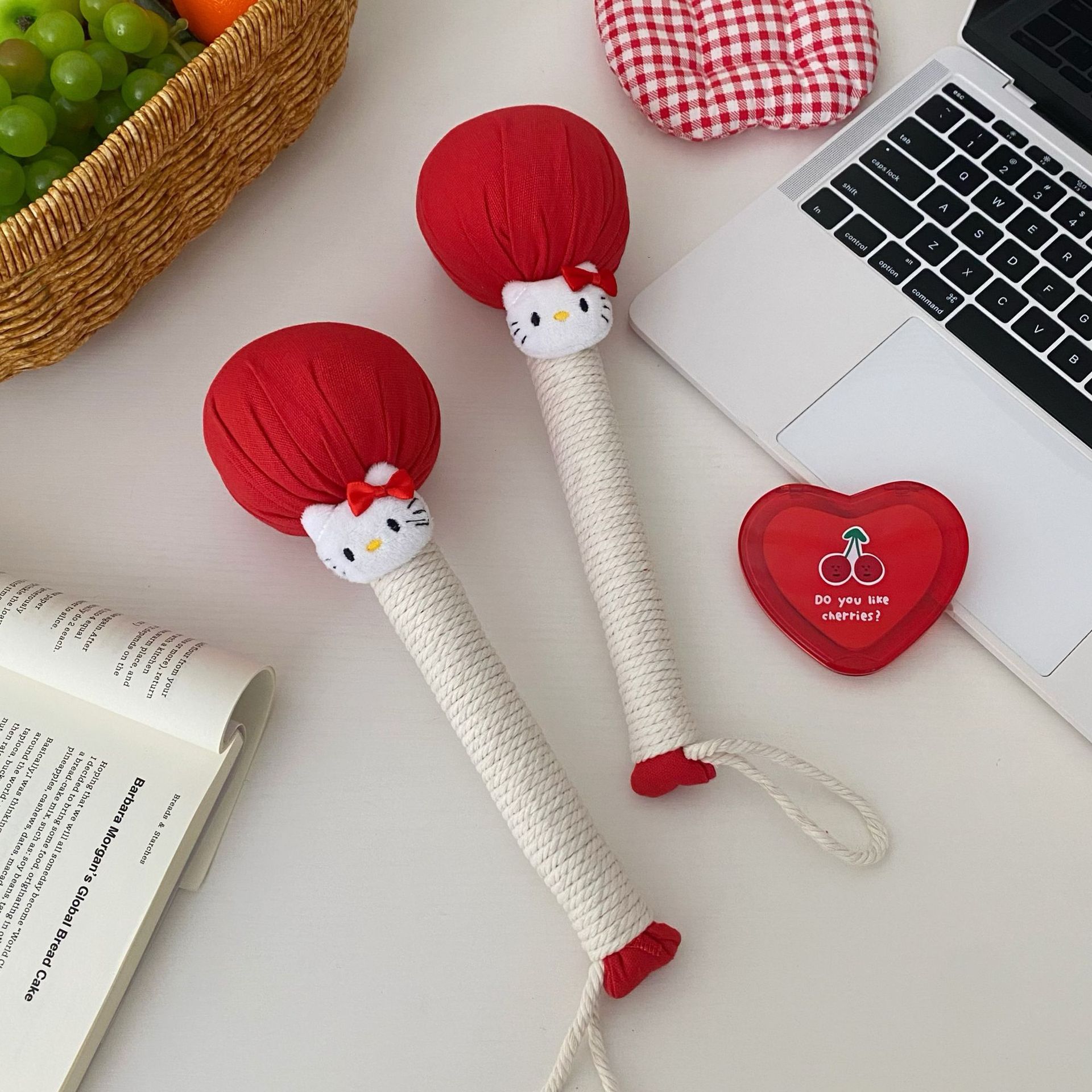 Festive red mugwort hammer, New Year cat pattern household handheld hammer, back massage hammer, leg joint tapping stick Application Scenario