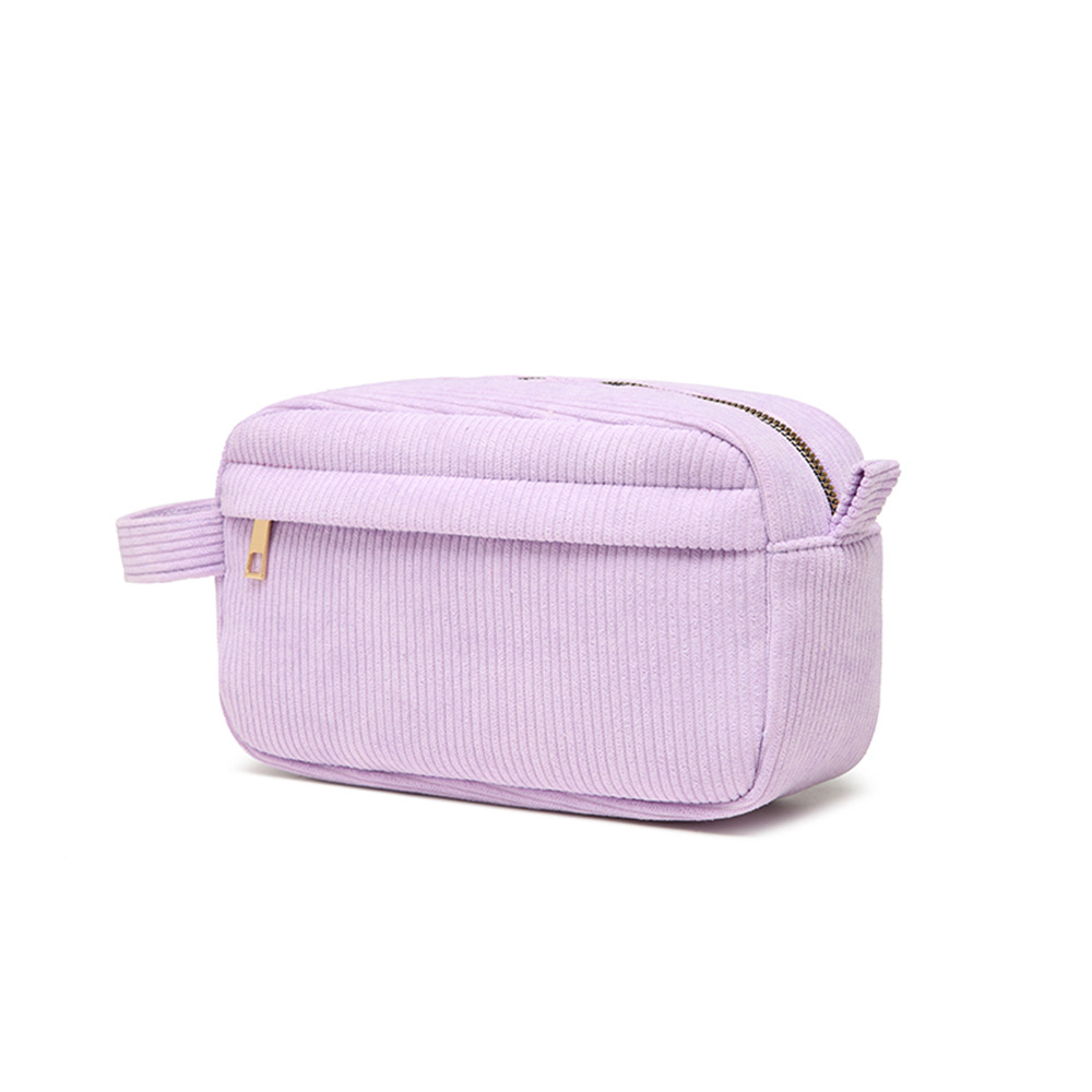 The new corduroy makeup bag is a fashionable, simple, mini and portable cosmetic lipstick storage bag with a large hand-held capacity full figure