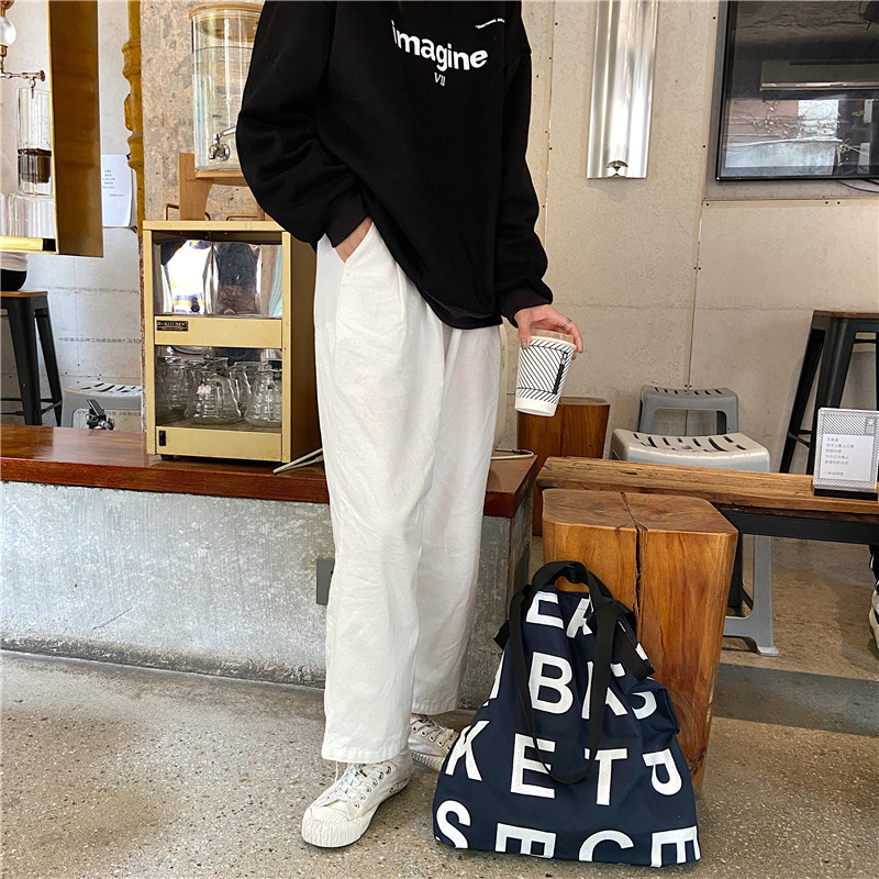 12281 Korean same style letter logo laid-back style large capacity shopping bag canvas bag wholesale in three colors Application Scenario
