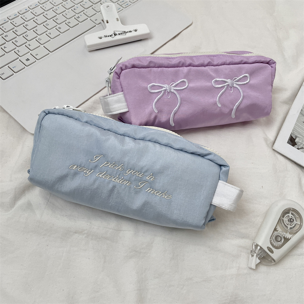 54202 Korean-style bow embroidery pen case, large-capacity, multi-functional, high-appearance-level stationery pencil box for male and female students Application Scenario