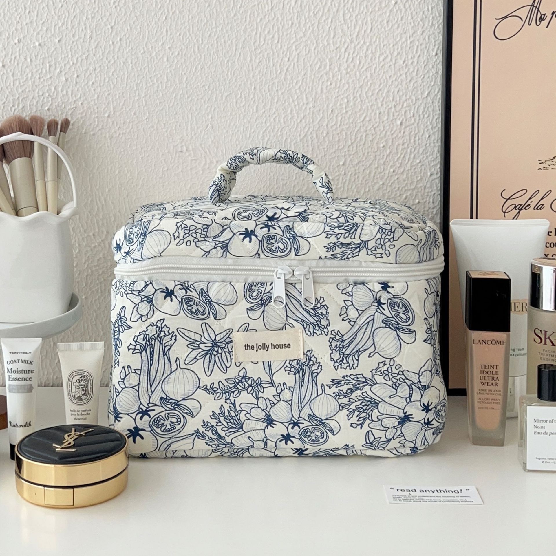 New deep blue flower makeup bag for women, a portable large-capacity cosmetics storage bag, and a hand-held toiletry bag for traveling Item Picture