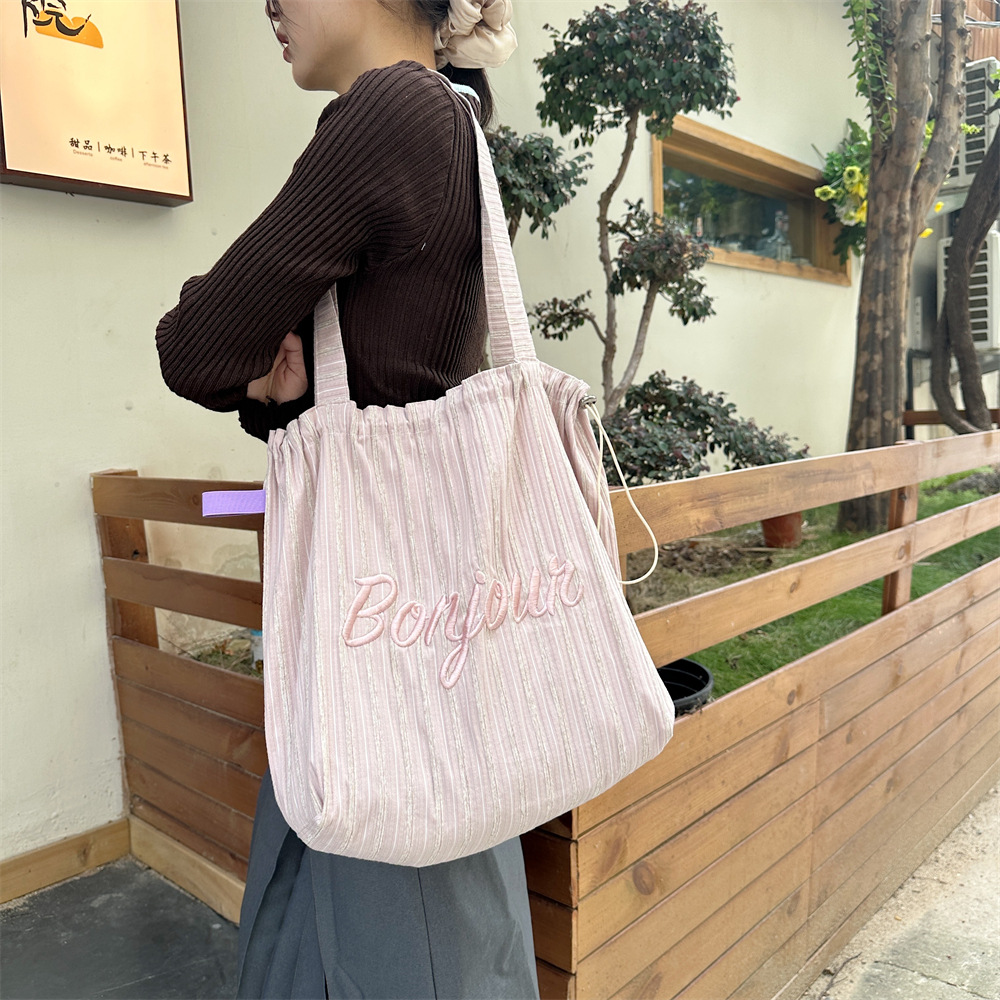 4922 Korean-style ins striped letter-embroidered single-shoulder tote bag, drawstring large-capacity canvas bag, commuter shopping bag details Picture