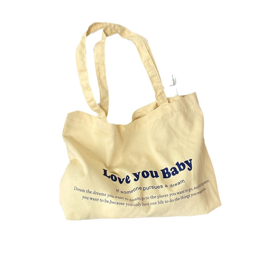 53142 Korean-style letter-printed canvas bag, a niche large-capacity commuter single-shoulder tote bag, suitable for carrying and shopping on one shoulder Item Picture