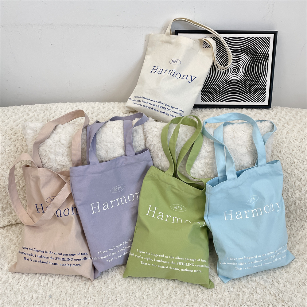 53223 Korean Instagram niche canvas bag, large capacity solid color letter printed shopping cloth bag, hand-held women's bag full figure