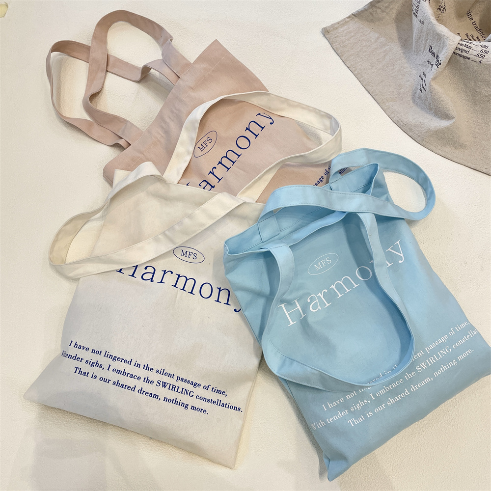 53223 Korean Instagram niche canvas bag, large capacity solid color letter printed shopping cloth bag, hand-held women's bag details Picture